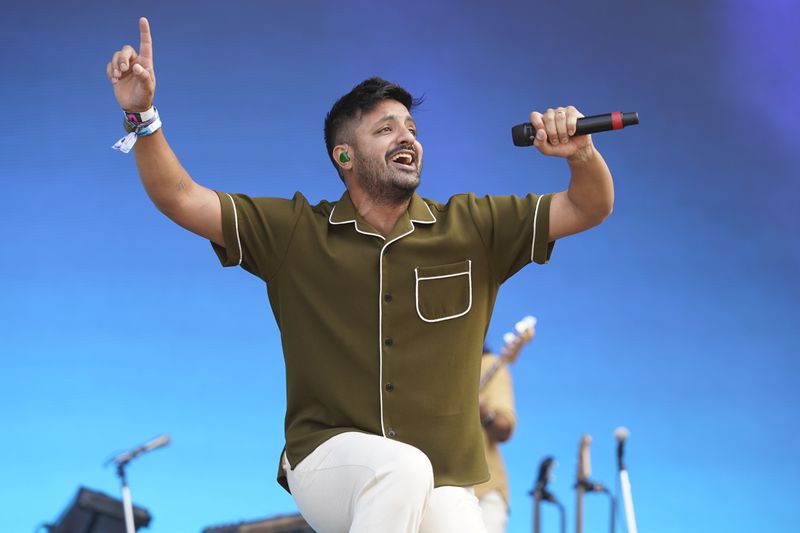 Sameer Gadhia, of the band Young the Giant, performs on Day 3 of the Lollapalooza music festival, Saturday, July 31, 2021, at Grant Park in Chicago. (Photo by Rob Grabowski/Invision/AP)