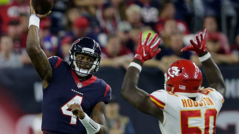 Texans quarterback Deshaun Watson throws a pass under pressure by Justin Houston of the Chiefs in the fourth quarter at NRG Stadium last Sunday night  in Houston.