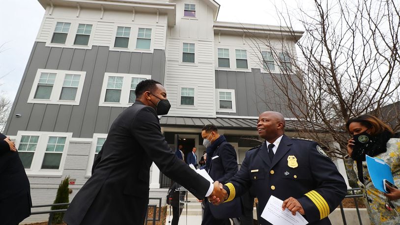 020222 Atlanta: Atlanta Mayor Andre Dickens and Police Chief Rodney Bryant greet each other as they arrive at the ribbon cutting for Unity Place, which is being called the nation's first apartment complex for Atlanta Police recruits on Wednesday, Feb. 2, 2022, in Atlanta.  “Curtis Compton / Curtis.Compton@ajc.com”`