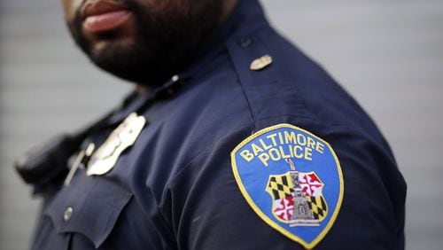 FILE- Would 100 armed police officers patrolling Baltimore’s Johns Hopkins University campus make the area safer for students and residents? Creators Syndicate columnist Walter E. Williams offers his perspective in today’s column. (AP Photo/Patrick Semansky, File)