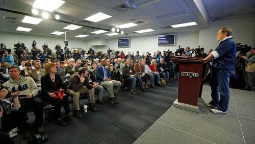 New England Patriots football head coach Bill Belichick, right, faces members of the media during a news conference prior to a team practice in Foxborough, Mass., Thursday, Jan. 22, 2015. Belichick addressed the issue of the NFL investigation of deflated footballs. (AP Photo/Elise Amendola) New England coach Bill Belichick throws himself on the mercy of the court. OK, not really. (AP photo)
