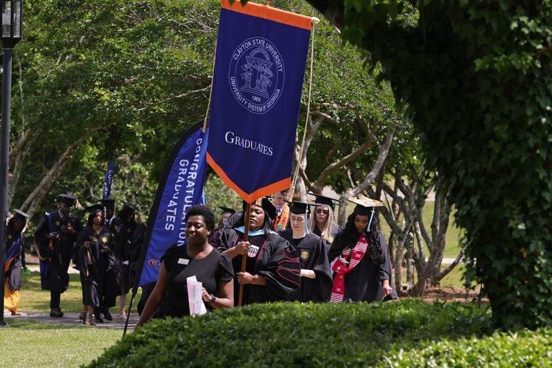 Clayton State University graduates walk into the Athletic Center for spring 2024 graduation ceremony on Friday, May 3, 2024. (Natrice Miller/ AJC)
