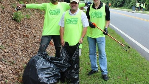 From left Chad Livsey, Joe Wilson and Snellville Mayor Pro Tem Dave Emanuel during a Snellville Clean and Proud work day on Oak Road. (Courtesy City of Snellville)