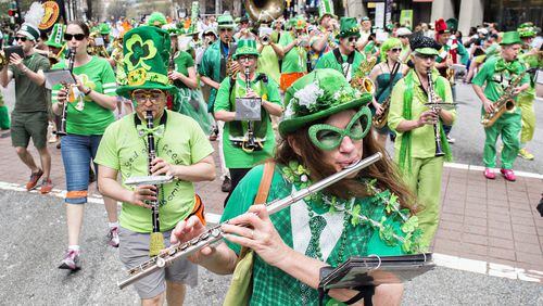 7 ways celebrate St. Patrick's Day in Atlanta    Charlotte Kilbride plays the flute as she marches down Peachtree St. during the annual Atlanta St. Patrick's Day Parade on Saturday, March 12, 2016. Tens of thousands of people lined Peachtree St. to watch the celebration that closed the street for just under two hours. JONATHAN PHILLIPS / SPECIAL