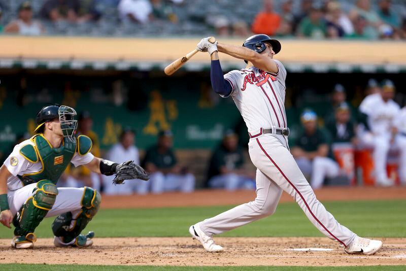Atlanta Braves' Matt Olson, right, hits a three-run home run in front of Oakland Athletics catcher Sean Murphy, left, during the third inning of a baseball game in Oakland, Calif., Tuesday, Sept. 6, 2022. (AP Photo/Jed Jacobsohn)