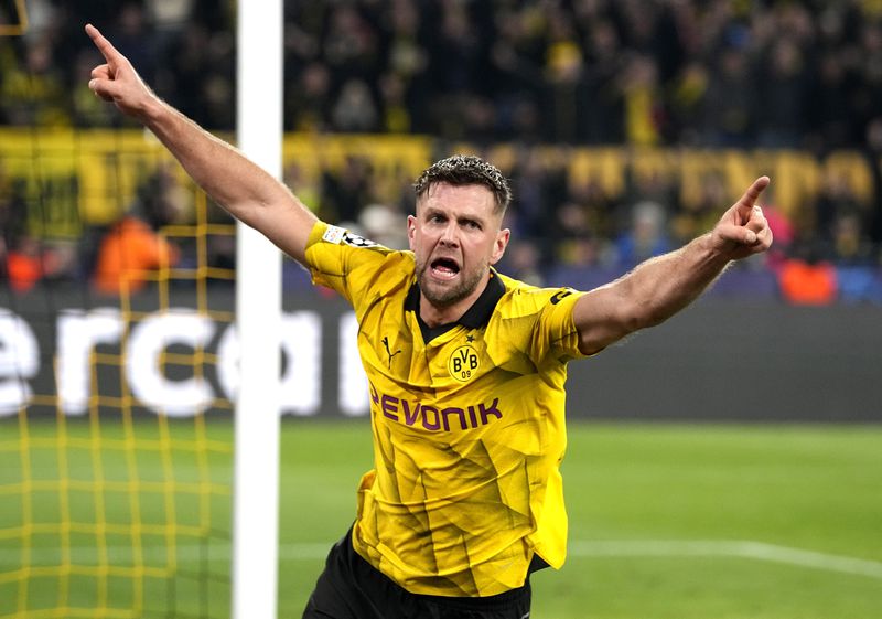 Dortmund's Niclas Fuellkrug celebrates his side's third goal during the Champions League quarterfinal second leg soccer match between Borussia Dortmund and Atletico Madrid at the Signal-Iduna Park in Dortmund, Germany, Tuesday, April 16, 2024(AP Photo/Martin Meissner)