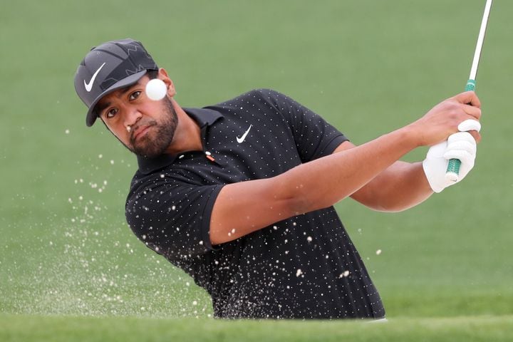 April 10, 2021, Augusta: Tony Finau hits out of the bunker on the second hole during the third round of the Masters at Augusta National Golf Club on Saturday, April 10, 2021, in Augusta. Curtis Compton/ccompton@ajc.com