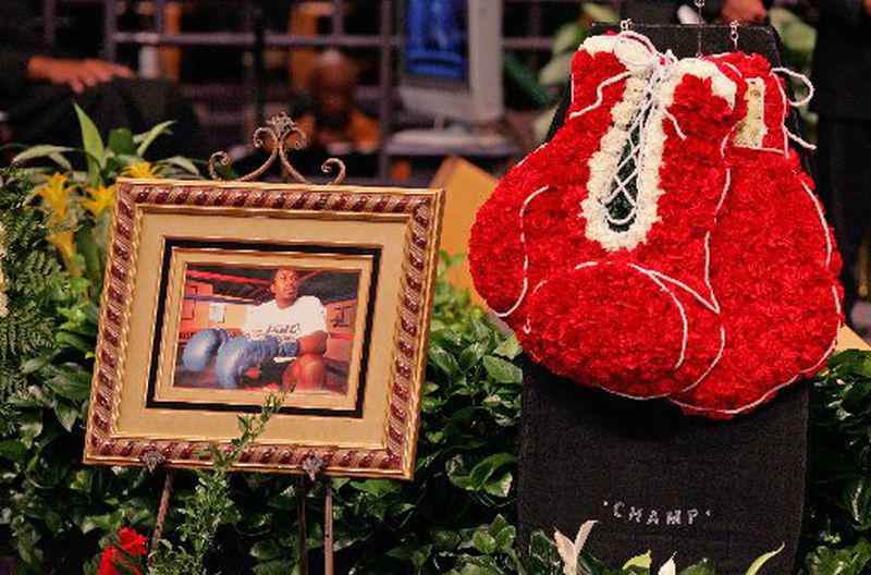 Flowers and photos were displayed around the casket of boxing champion Vernon Forrest at his funeral in 2009. BOB ANDRES / BANDRES@AJC.Com