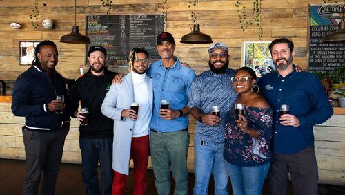 Isaac Smith (from left), Adam Beauchamp, Shakeel Radford, Fenwick Broyard, Isaiah Smith, Josie Footman-Smith and Dan Reingold are among those involved in the Creature Comforts/Our Culture collaboration. Courtesy of Creature Comforts Brewing Co.