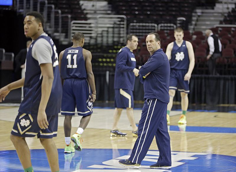 CORRECTS FIRST NAME TO MIKE, NOT MILE - Notre Dame head coach Mike Brey, center right, watches his team during practice at the NCAA college basketball tournament, Wednesday, March 25, 2015, in Cleveland. Notre Dame plays Wichita State in a regional semifinal on Thursday. (AP Photo/Tony Dejak) Notre Dame coach Mike Brey at practice here Thursday. (AP photo/Tony Dejak)
