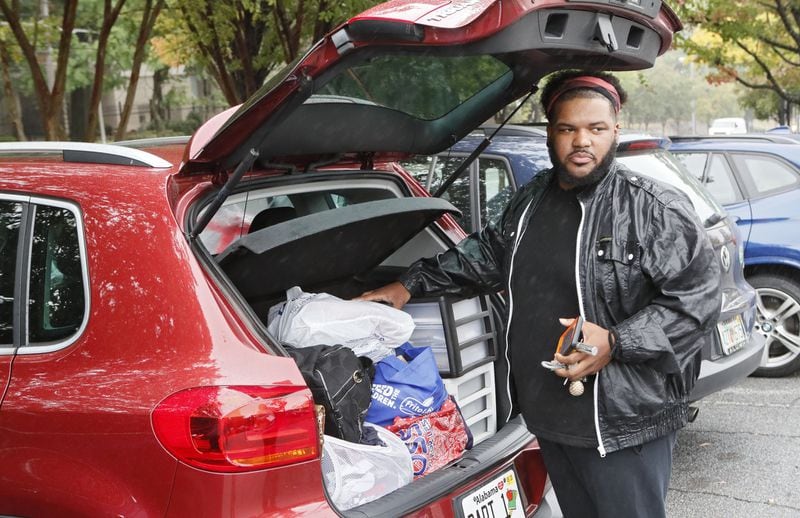 Caleb Webb, 29, has many of his possessions organized in his car. He is homeless and has been staying at friends’ homes and occasionally out of his car. The closure of nonprofit contractor Living Room has left more than two dozen counties in and around metro Atlanta with no central intake for the $23 million Housing Opportunities for Persons with AIDS program. BOB ANDRES / ROBERT.ANDRES@AJC.COM