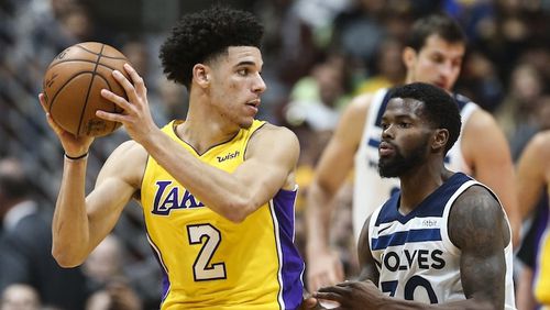 Los Angeles Lakers guard Lonzo Ball, left, poses against  Minnesota Timberwolves guard Aaron Brooks during the second half of an NBA preseason basketball game in Anaheim, Calif., Saturday, Sept. 30, 2017. The Timberwolves won 108-99.  (AP Photo/Ringo H.W. Chiu)