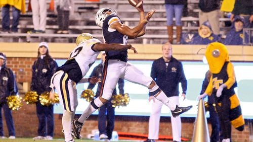 Virginia's Andre Levrone catches would was the winning touchdown pass over Georgia Tech's Lance Austin late in the fourth quarter Saturday. (Ryan M. Kelly/Getty Images)