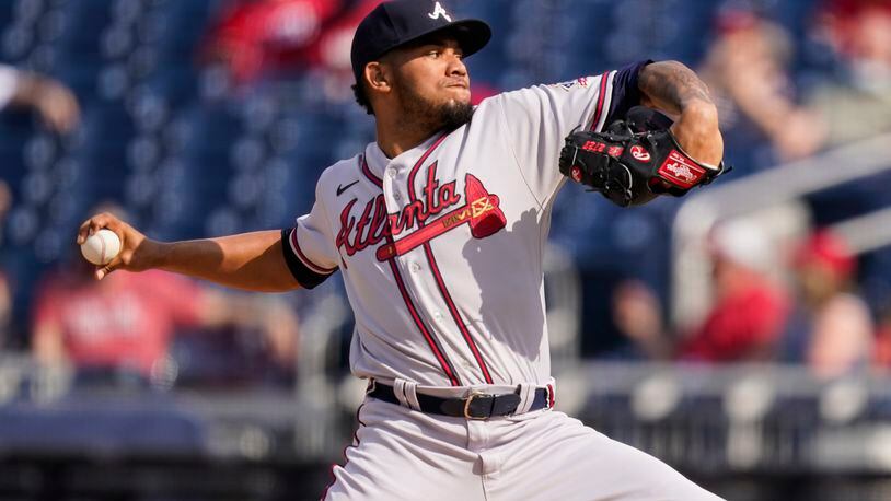 Atlanta Braves starting pitcher Huascar Ynoa throws during the first inning of the second baseball game of a doubleheader against the Washington Nationals, at Nationals Park, Wednesday, April 7, 2021, in Washington. (AP Photo/Alex Brandon)