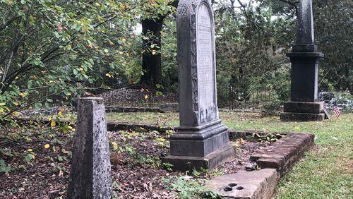 The Founders Cemetery is visited during the Roswell Ghost Tours. The guide of this particular tour no longer enters cemeteries, but guests are welcome to walk around. Shown are three gravesites (left to right): Unknown marker, remains of husband and wife - John Dunwoody, Esq and Jane Bulloch - and Roswell KIng.