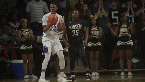 South Atlanta senior Tyler Thornton (15) and Swainsboro sophomore Jamal Watkins (35) react to a play in the first half of their Class AA state championship game at Georgia Tech's McCamish Pavillion Saturday, March 11, 2017.