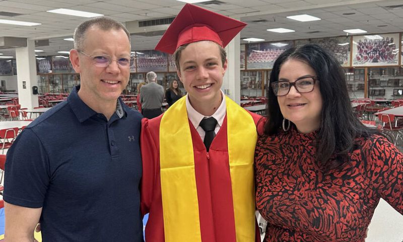Sam Dodson with his parents, Sarah and Jeff, at the National Honor Society ceremony. (Photo provided by Sam Dodson)