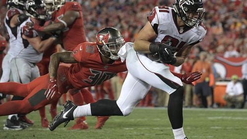 Atlanta Falcons tight end Austin Hooper (81) beats Tampa Bay Buccaneers free safety Bradley McDougald (30) on a 2-yard touchdown reception during the fourth quarter of an NFL football game Thursday, Nov. 3, 2016, in Tampa, Fla. (AP Photo/Phelan Ebenhack)