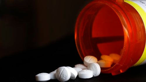 A pharmacist from southern Georgia is heading to federal prison after pleading guilty to a crime involving fraud and illegal distribution of opioids. (AP Photo/Mark Lennihan, File)