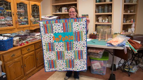 Mary Stevens holds a quilt she made for a child being treated at the Aflac Cancer Center at Children’s Healthcare of Atlanta at Scottish Rite. Stevens, shown at her Canton home, began making quilts for other children at Scottish Rite when her son Michael Stevens was diagnosed with acute lymphoblastic leukemia when he was 4 years old in 1996. It’s estimated she has made as many as 1,000 of the colorful, comforting handmade blankets. BRANDEN CAMP / SPECIAL