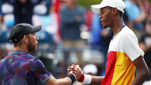 NEW YORK, NY - AUGUST 28: Dudi Sela of Israel shakes hands with Christopher Eubanks of the United States after their first round Men's Singles match on Day One of the 2017 US Open at the USTA Billie Jean King National Tennis Center on August 28, 2017 in the Flushing neighborhood of the Queens borough of New York City.  (Photo by Clive Brunskill/Getty Images)