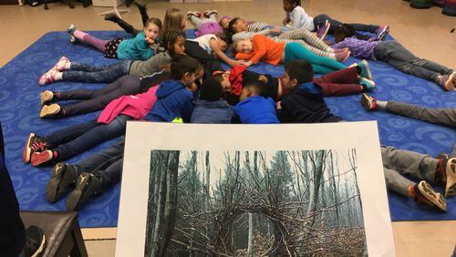 Incorporating arts into their coursework, students at Henderson Mill Elementary recreate form the image of a wreath. The Northlake area school recently earned the first STEAM certification in the state. Contributed.