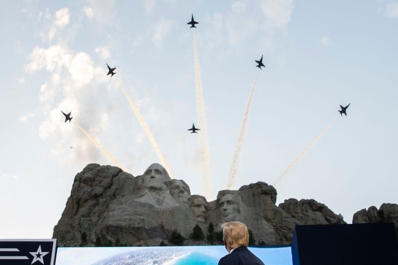 President Donald Trump watches a flyover by the U.S. Navy Blue Angels at Mount Rushmore National Memorial. (AP Photo/Alex Brandon)