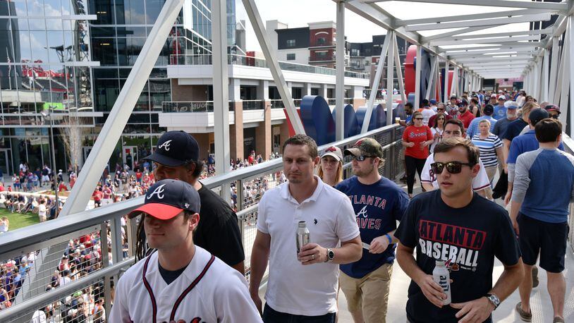 Fans enter the stadium to see the Atlanta Braves play the San Diego Padres in the season opener in the new SunTrust Park Friday.