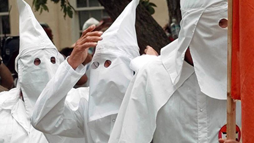 Members of the Ku Klux Klan wear hoods during a 1998 rally.