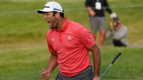 Jon Rahm reacts accordingly after making a putt longer than "War and Peace" on the first playoff hole at the BMW Championship Sunday.
