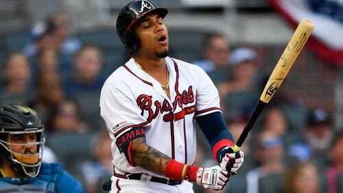 Braves' Johan Camargo reacts after hitting a shallow pop fly to right field for an out during the ninth inning of the team's baseball game against the Miami Marlins, Saturday, July 6, 2019 in Atlanta. Miami won 5-4. (AP Photo/John Amis)