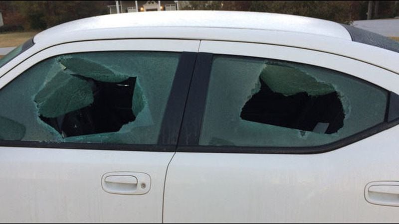 Bullet holes cover the car of the assistant police chief in Monroe. (Credit: Channel 2 Action News)