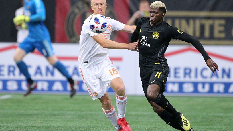August 19, 2018 Atlanta: Atlanta United midfielder Jeff Larentowicz and Columbus Crew forward Gyasi Zardes battle for the ball during the second half in a MLS soccer match on Sunday, August 19, 2018, in Atlanta.  Curtis Compton/ccompton@ajc.com