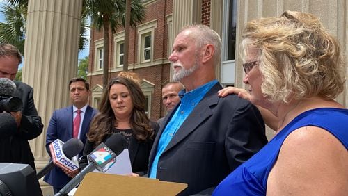 Dennis Perry spoke to the news media after a judge exonerated him in a 1985 Georgia church murders cases on July 19, 2020 in Brunswick, Georgia. Perry's wife, Brenda, has her hand on his shoulder. (Joshua Sharpe / AJC)