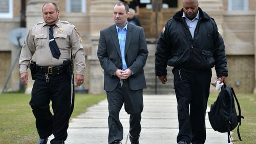 Ryan Alexander Duke, who is charged with murder in the Grinstead case, is escorted out after his motion hearings before Chief Judge of the Tifton Circuit Bill Reinhardt at Irwin County Courthouse in Ocilla on Monday.HYOSUB SHIN / AJC
