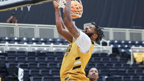 Kennesaw State forward Demond Robinson dunks during practice at the Convocation Center on the Kennesaw State campus, Tuesday, October 24, 2023, in Kennesaw, Ga. (Jason Getz / Jason.Getz@ajc.com)