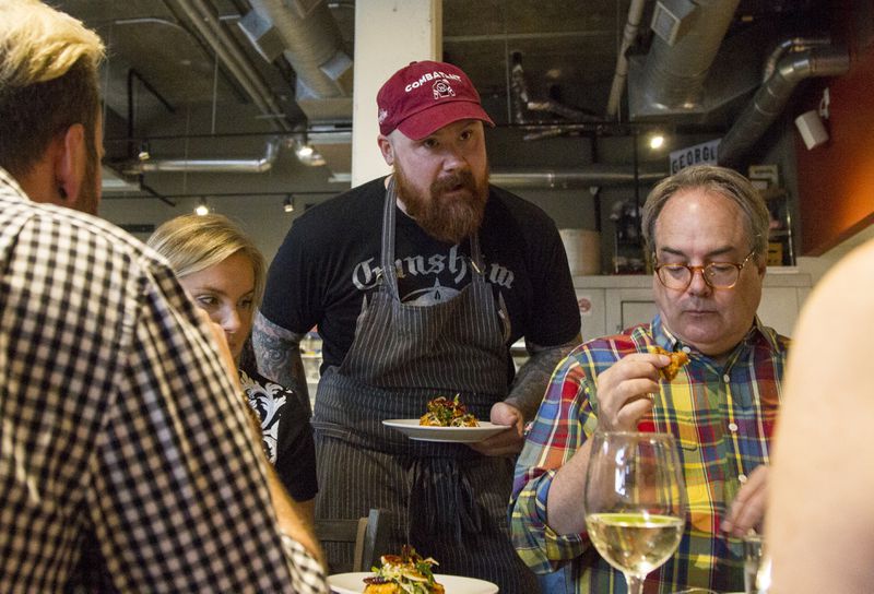 Kevin Gillespie serves a dish for the dinner crowd May 8, 2018 at Gunshow in Atlanta. Gillespie was recently diagnosed with renal cancer and will have to undergo treatment. (REANN HUBER/REANN.HUBER@AJC.COM)