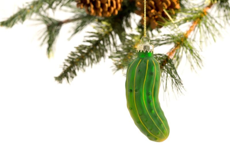 In Michigan, it is a tradition to hang a pickle ornament on the Christmas tree. The first child to find the ornament Christmas morning gets an extra gift. The tradition was once thought to have origins in Germany, but that is not the case. The origin may come from Georgia. According to some, a German-born Union solider captured and held as a prisoner at Camp Sumter in Georgia begged for a pickle on Christmas Day. The guard gave him one and every year after his release he hung a pickle in his Christmas tree.