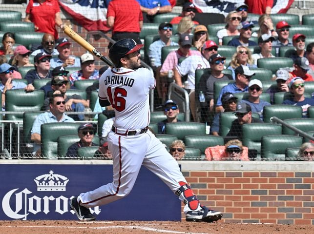 Atlanta Braves' Travis d'Arnaud hits a solo home run during the second inning of game one of the baseball playoff series between the Braves and the Phillies at Truist Park in Atlanta on Tuesday, October 11, 2022. (Hyosub Shin / Hyosub.Shin@ajc.com)