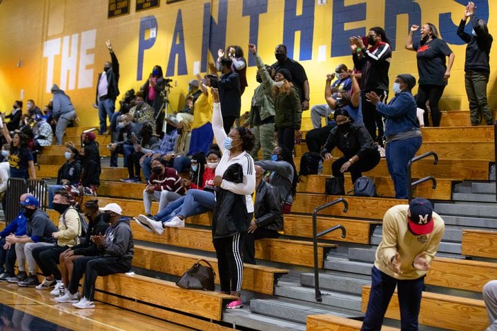 Fans of the South Dekalb High School girls basketball team cheer at the end of the South Dekalb vs. Cass High School girls basketball playoff game on Friday, February 26, 2021, at South Dekalb High School in Decatur, Georgia. South Dekalb defeated Cass 72-46. CHRISTINA MATACOTTA FOR THE ATLANTA JOURNAL-CONSTITUTION