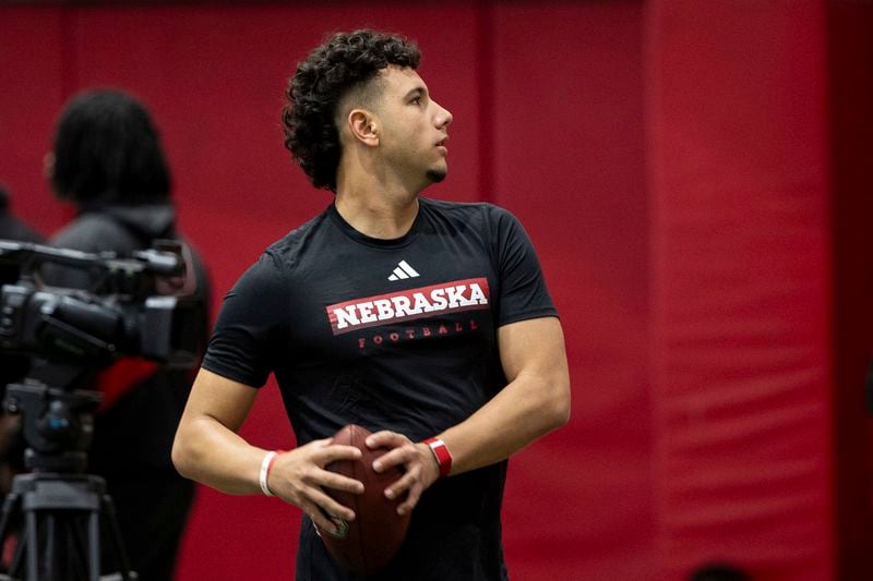 FILE - Nebraska quarterback Dylan Raiola throws passes for teammates during the NCAA college football team's NFL Pro Day, Wednesday, March 20, 2024 in Lincoln, Neb. Raiola is the highest-ranked recruit in Nebraska program history and is the presumed starter this fall. (Anna Reed/Omaha World-Herald via AP, File, File)