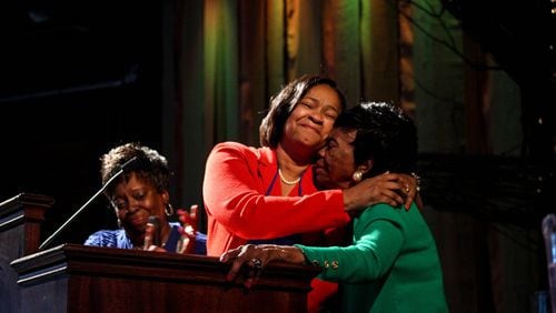 After her election as bishop, Sharma Lewis is congratulated by her sister Le Ontyne Buggs and her mother, Aleathia Lewis. CONTRIBUTED BY NORTH GEORGIA CONFERENCE OF THE UNITED METHODIST CHURCH