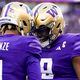 Washington wide receiver Rome Odunze (1) greets quarterback Michael Penix Jr. (9) after making a touchdown catch against Washington State during the first half of an NCAA college football game Saturday, Nov. 25, 2023, in Seattle. (AP Photo/Lindsey Wasson)