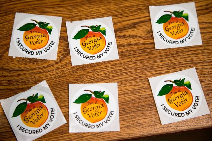 Stickers are ready to hand out as voters cast their ballots at the Dunwoody Library as the polls opened at 7am on election day Nov 3rd, 2020. PHIL SKINNER FOR THE ATANTA JOURNAL-CONSTITUTION