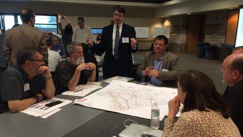 Gwinnett County Transportation Director Alan Chapman speaks with residents at a recent public hearing in Buford. The county is holding a series of hearings to gather public opinion about Gwinnett’s transportation needs.