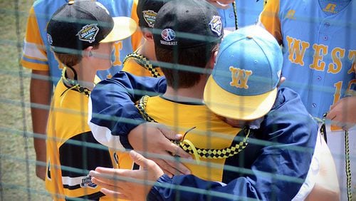 Players from Peachtree City, Georgia and Honolulu, Hawaii hug before facing off in the U.S. Championship of the Little League World Series on Aug. 25 at Howard J. Lamade Stadium in Williamsport, Pennsylvania.