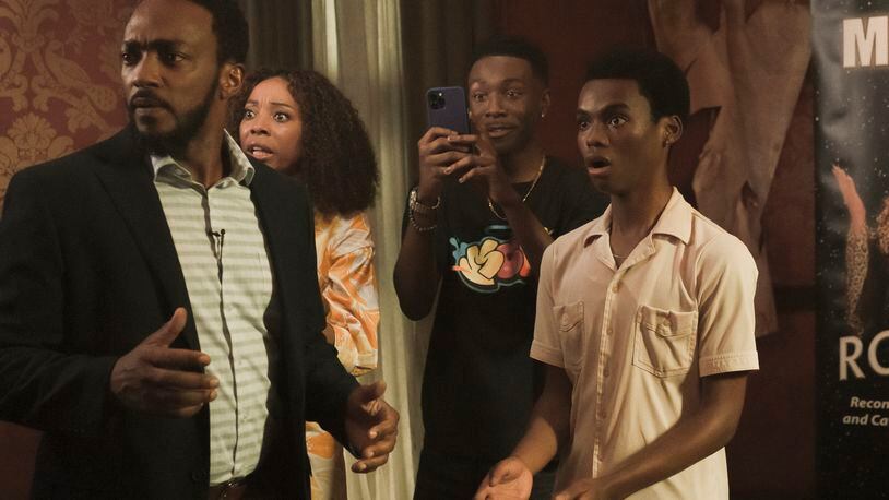 We Have A Ghost stars (L to R) Anthony Mackie as Frank, Erica Ash as Melanie, Niles Fitch as Fulton, and Jahi Winston as Kevin. / Cr. Scott Saltzman/Netflix © 2022.