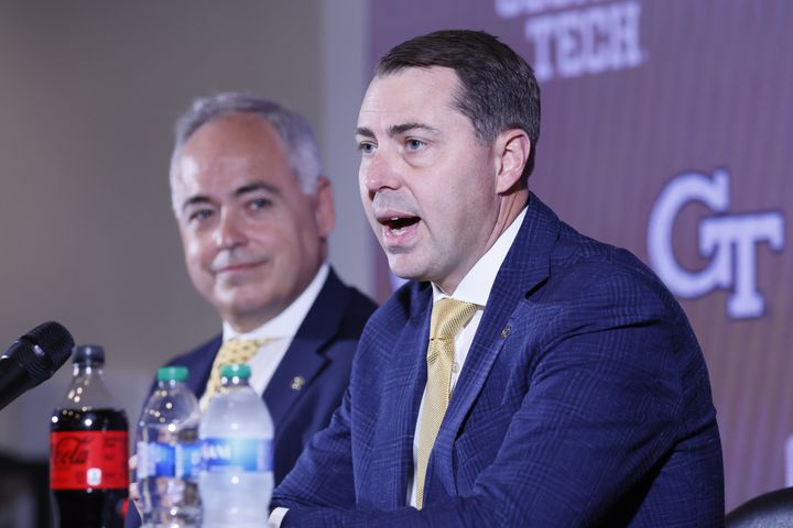 New Georgia Tech AD J Batt answers questions from the media as Tech President Angel Cabrera looks on Monday. (Miguel Martinez / miguel.martinezjimenez@ajc.com)