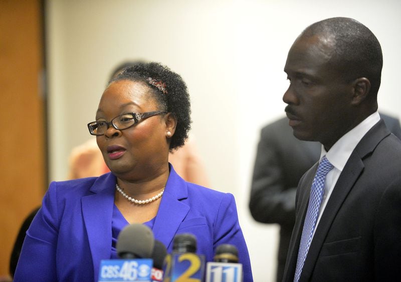 “I have no regrets about not taking the deal. I’m innocent,” said former Dunbar Elementary School teacher Diane Buckner-Webb. With her was  her defense attorney Keith Adams at the law offices of defense attorney George Lawson Friday, April 17, 2015. KENT D. JOHNSON /KDJOHNSON@AJC.COM