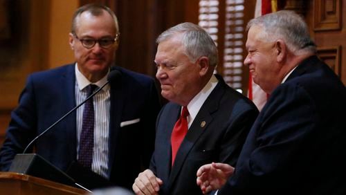 As Lt. Gov. Casey Cagle (left) and House Speaker David Ralston (right) look on, Gov. Nathan Deal tears up at his final State of the State address earlier this month. BOB ANDRES /BANDRES@AJC.COM